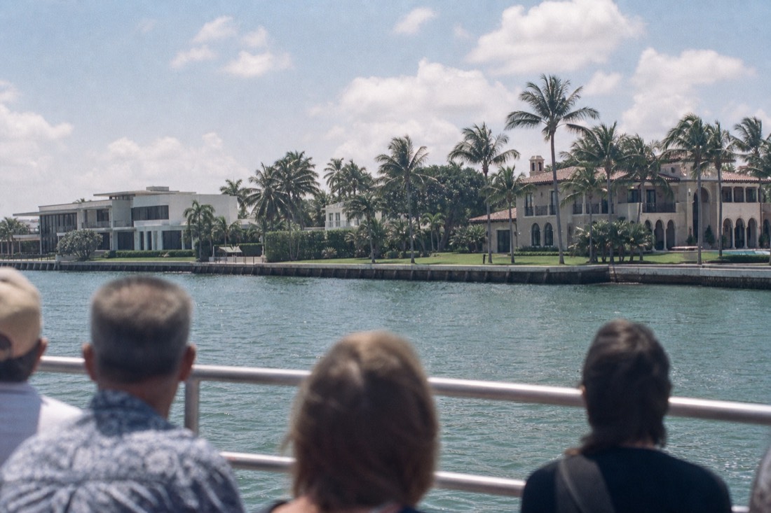 Narrated sightseeing boat cruising past waterfront mansions on Star Island in Biscayne Bay